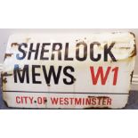 An enamel London street sign: Sherlock Mews - City of Westminster W1 (traffic damaged) (71 x 44cm)