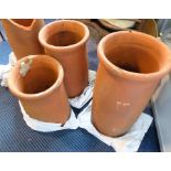 Three terracotta chimney pots (as planters)