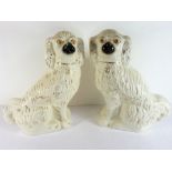 A large pair of 19th century Staffordshire Pottery spaniels (33cm high)
