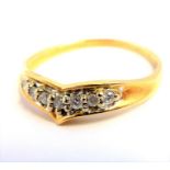 A yellow-gold ring set with seven diamonds  (The cost of UK postage via Royal Mail Special