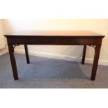 An 18th century mahogany side table; the moulded top above plain frieze and square Marlborough-style