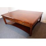 A good and large mahogany and cross-banded low coffee table; each side with three drawers and raised