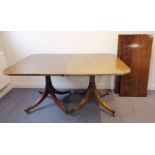 A good Regency-style extending mahogany dining table having two extra leaves; the reeded edge top