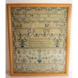 A George IV (dated 1820) framed and glazed (later) needlework sampler; intricately sewn with