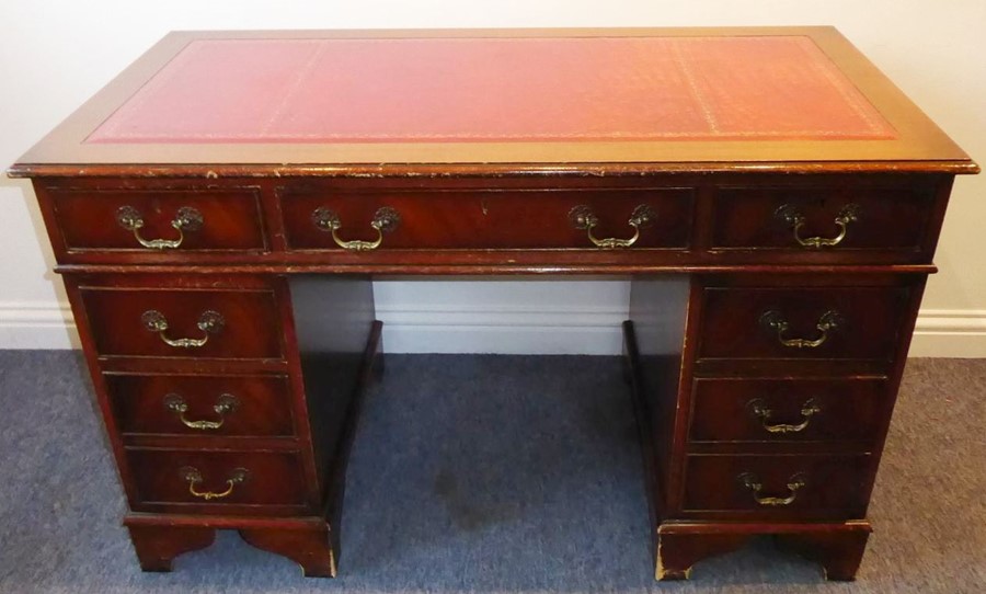 A reproduction mahogany Georgian-style pedestal desk; red-leather-inset top above an arrangement - Image 2 of 6