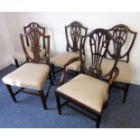A harlequin set of five Hepplewhite-style mahogany dining chairs comprising one carver and four