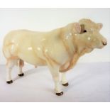 A large John Beswick model of a bullock; signed to underside (23.5cm long)