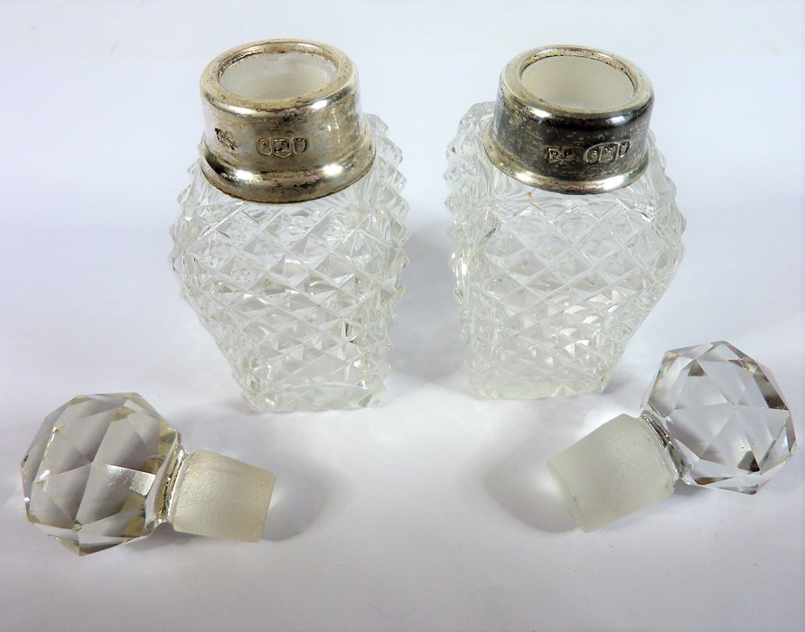 A pair of cut-glass silver-mounted scents Condition Report: The first scent - the silver mount on - Image 2 of 2