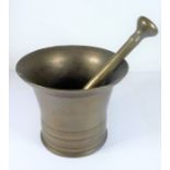 A heavy 19th century bell-metal pestle and mortar