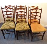 A set of six early 20th century continental-style walnut ladder-back dining chairs with stuff-over