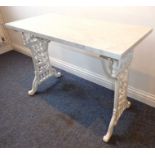 A white marble-topped side table; in 19th century style with heavyweight white-painted cast-iron