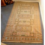 A hand-knotted Persian carpet, mostly beige ground (266cm long x 161cm wide)