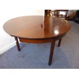 An oval drop-leaf mahogany gate-leg dining table raised on square moulded legs (132cm wide)