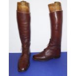 A pair of gentleman's brown-leather hunting boots with wooden trees (estimated size 6-7)