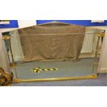 A very large and fine wall-hanging overmantle mirror; gilded and hand bevelled, two Doric columns