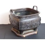 A large mid-19th century Japanese two-handled temple censer in patinated bronze; Xuande mark below