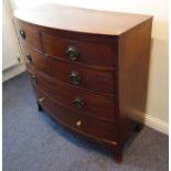 An early 19th century bow-fronted mahogany chest; the two half-width drawers over three full-width