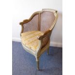 An early 20th century (in late 18th century style) carved and rattan-cane upholstered bergère