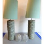 A pair of heavy mid-20th century cylindrical art pottery lamps having celadon glaze and matching