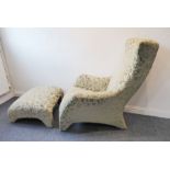 A fine upholstered modern designer armchair together with matching angular pouffe; the entire