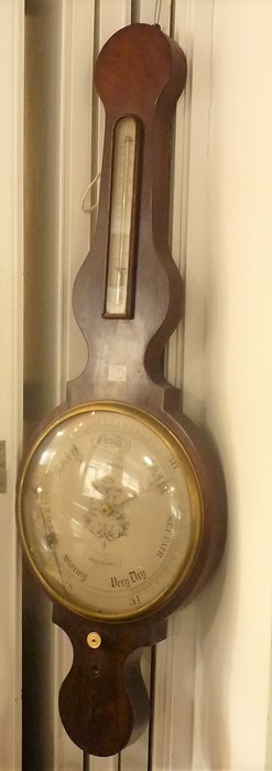An oversized mid-19th century wheel barometer; silvered thermometer dial and the round silvered