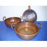 A pair of late 19th/early 20th century two-handled copper preserve pans together with a 19th century