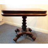 A good late Regency period fold-over top mahogany card table; the stem carved with bulbs in