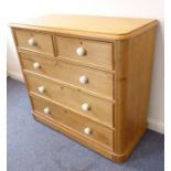 A good late 19th century pine chest; two half-width over three full-width graduated drawers with