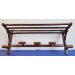 A five-coat wallhanging oak coat-hook with upper hat rack (approx 85cm wide)No woodworm; there is