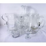 Four jugs and miscellaneous glass, one with an engraved leaping salmon, the tallest 29cm, the