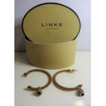 A pair of hoop-style earrings in .925 silver-gilt by Links of London (boxed)  (The cost of UK
