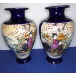 An opposing pair of early 20th century Japanese baluster-shaped pottery vases; each hand-decorated
