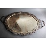 A large and heavy late 19th / early 20th century two-handled silver-plated serving tray; the central