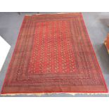 A large hand-knotted Pakistan Bokhara carpet; the central rectangle with 150 elephant feet within