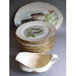 Twelve French porcelain plates with gilded borders and decorated with six different fish designs (