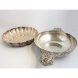 Two pieces of hallmarked silver: a mid-20th century porringer with two handles decorated with