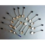 A set of twelve hallmarked silver coffee spoons with 'coffee bean' terminals; together with five