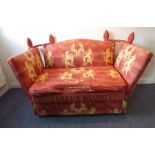 A good upholstered two-seater Knowle-style sofa; the cushion, sides and back decorated with