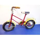 A 1950s/1960s red and yellow painted child's bicycle (to be sold in aid of the Little Hearts