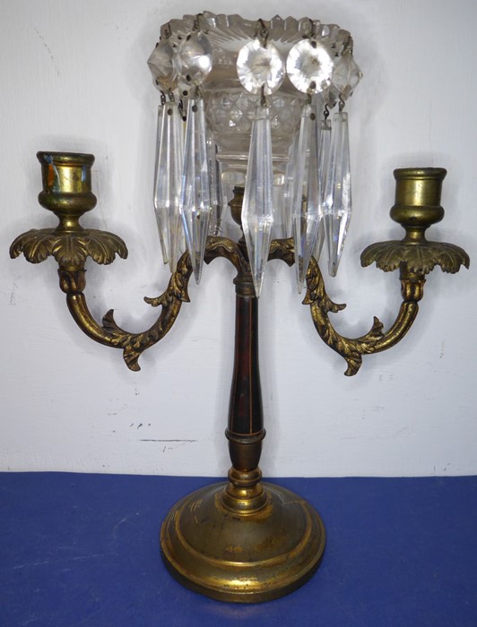 A 19th century gilt-metal and cut-glass two-branch candelabra; hanging hand-cut faceted lustres (