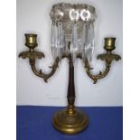 A 19th century gilt-metal and cut-glass two-branch candelabra; hanging hand-cut faceted lustres (
