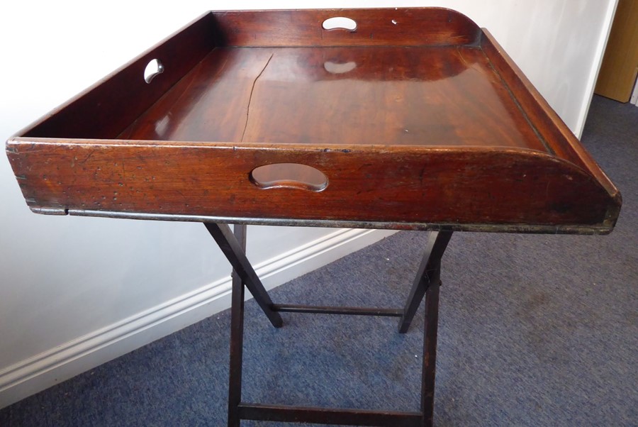 A 19th century three-handled mahogany butler's tray on stand; the folding x-frame stand with two - Image 10 of 15