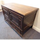 A good late 17th century oak mule chest; the planked moulded top opening on original hinges and with