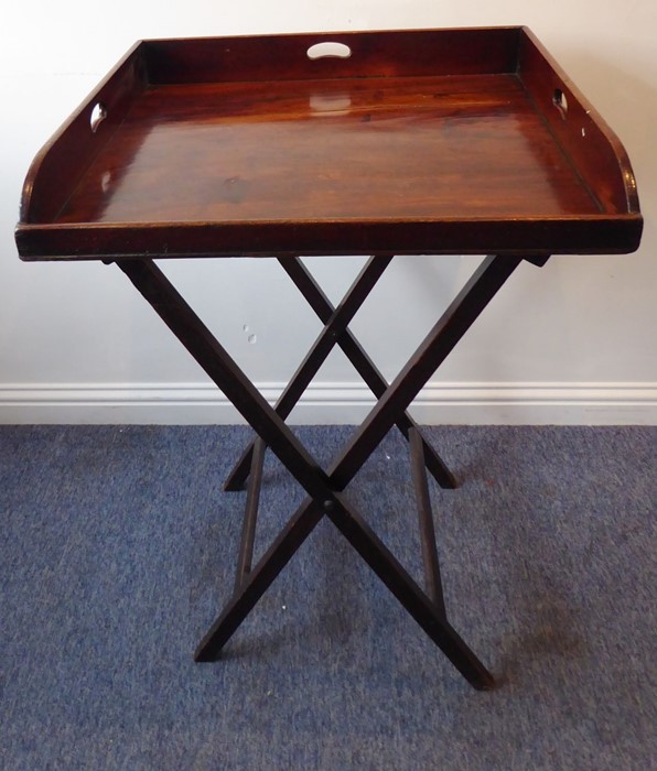 A 19th century three-handled mahogany butler's tray on stand; the folding x-frame stand with two - Image 2 of 15