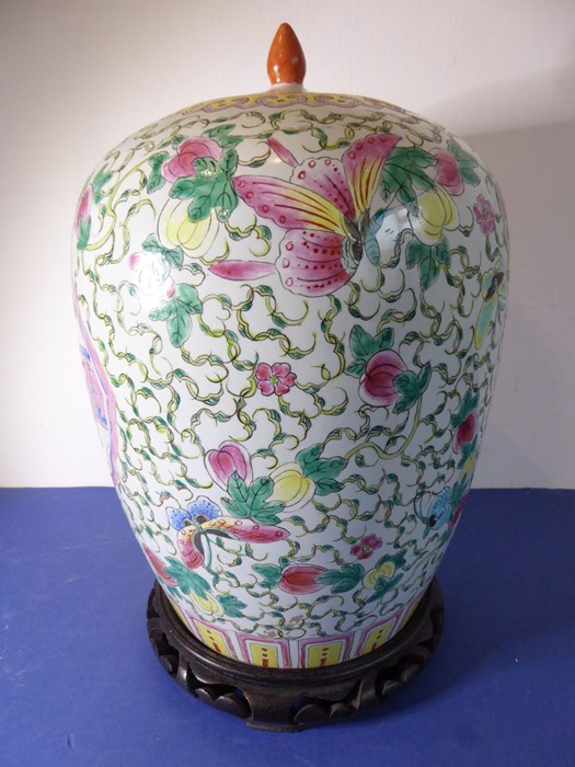 A Chinese porcelain vase of baluster form; the cover decorated with a moth and fruits and above a - Image 2 of 11