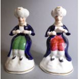 Two unusual 19th century Staffordshire-style figures; both modelled as seated moustachioed males