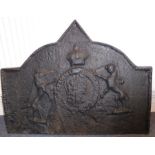 A large cast-iron fire-back; centrally decorated in relief, crown over crest flanked by two mythical