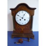 A good early 20th century mahogany and marquetry-cased eight-day mantle clock; the white-enamel dial