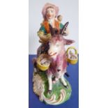 A circa 1775-1795 Derby porcelain figure, 'Welch Tailor's Wife Riding a Goat'; the babies, baskets