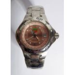 A lady's TAG Heuer - Professional Automatic wristwatch; the unusual pink dial with Arabic numerals